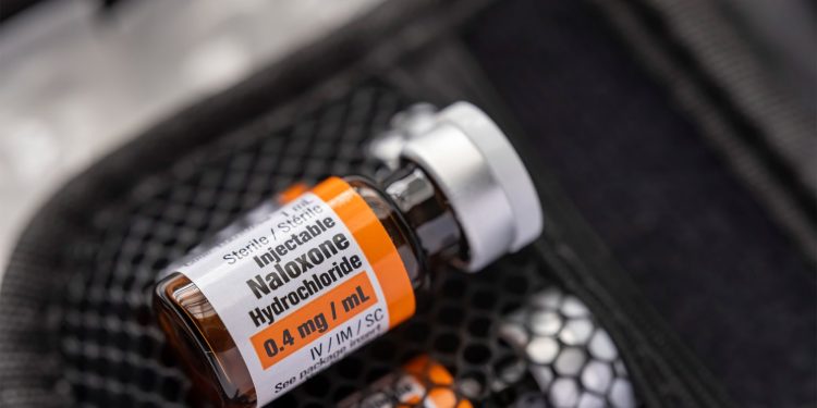 Implantable device responds to opioid overdose